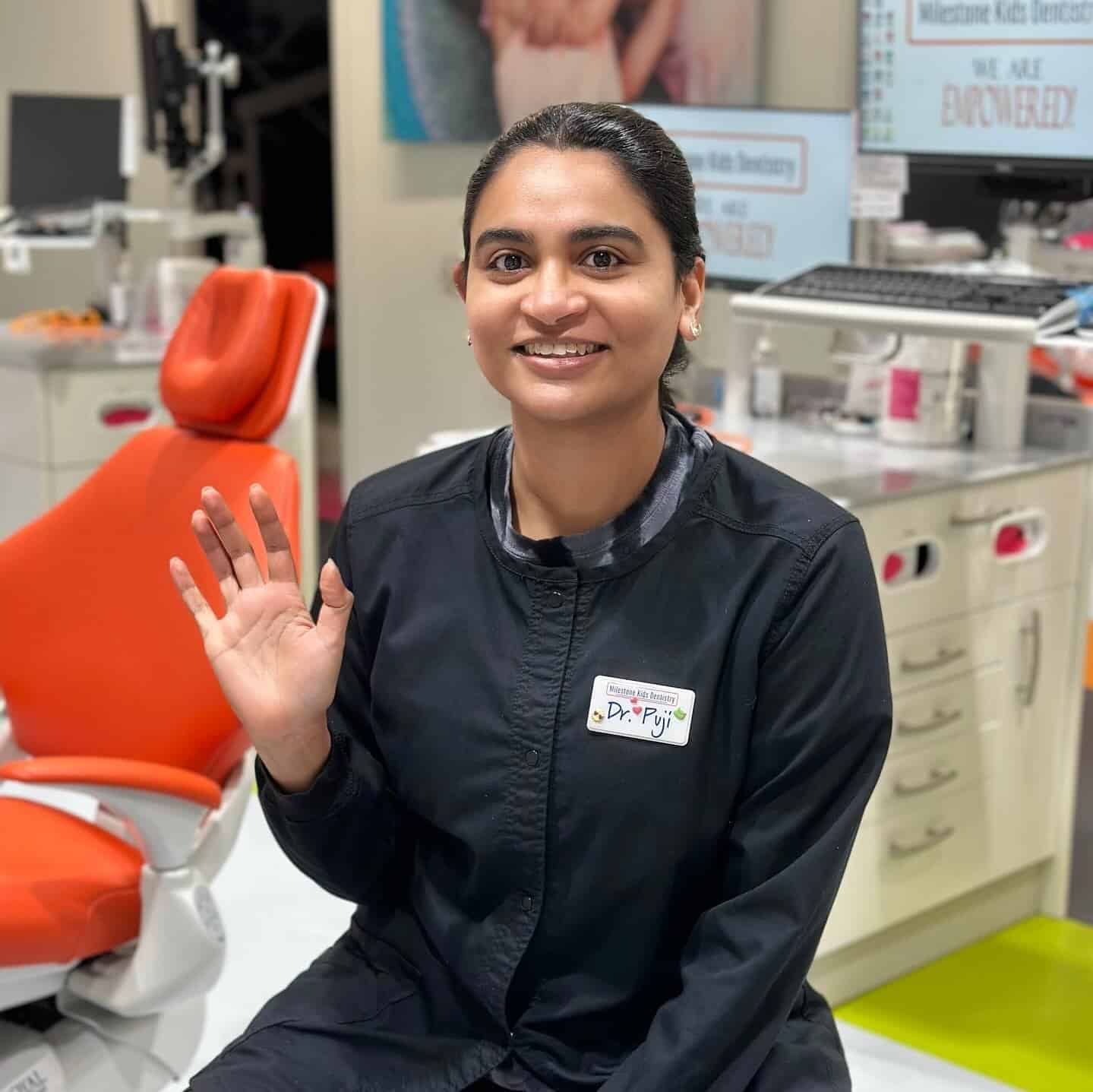 Dr. Puji waving to the camera
